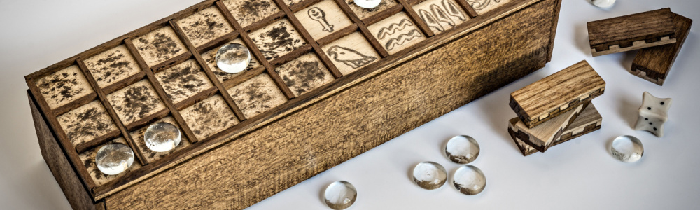 senet game - and old box with tiles and rings