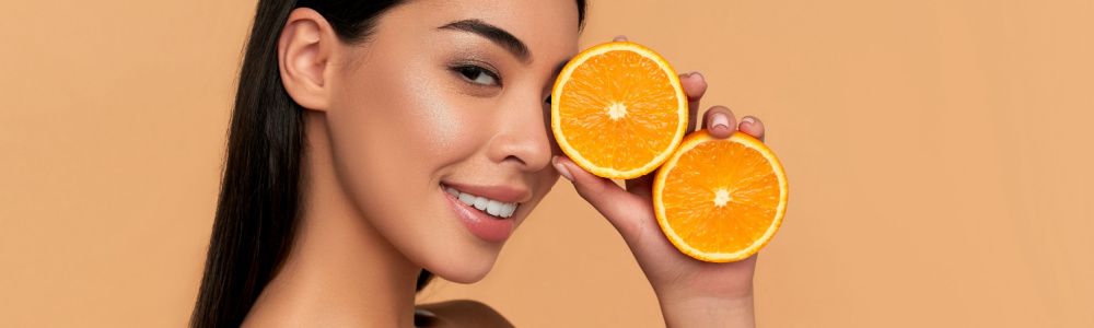 girl holding an orange