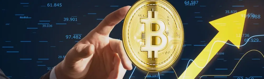 finger pointing to a bitcoin