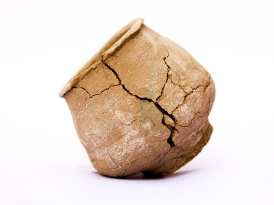 broken clay pot on a white background
