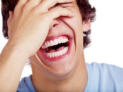 close up of man laughing hysterically