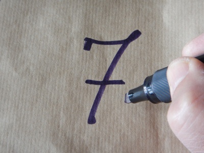 the number 7 written on wrapping paper with a marker