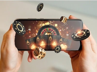 smartphone with casino imagery - roulette wheel and chips flying out
