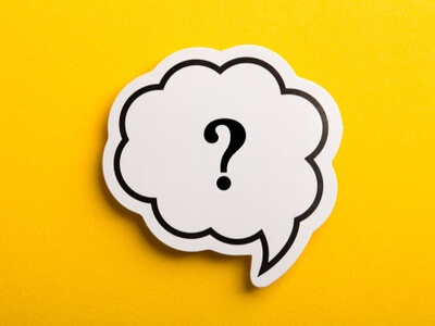 question mark in a conversation bubble on a yellow background