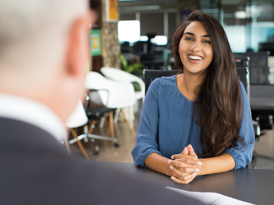 woman sitting across from a man in a job interview